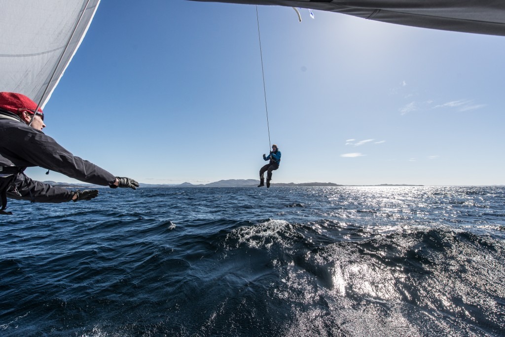 Robinson doing a pendulum from the mast.