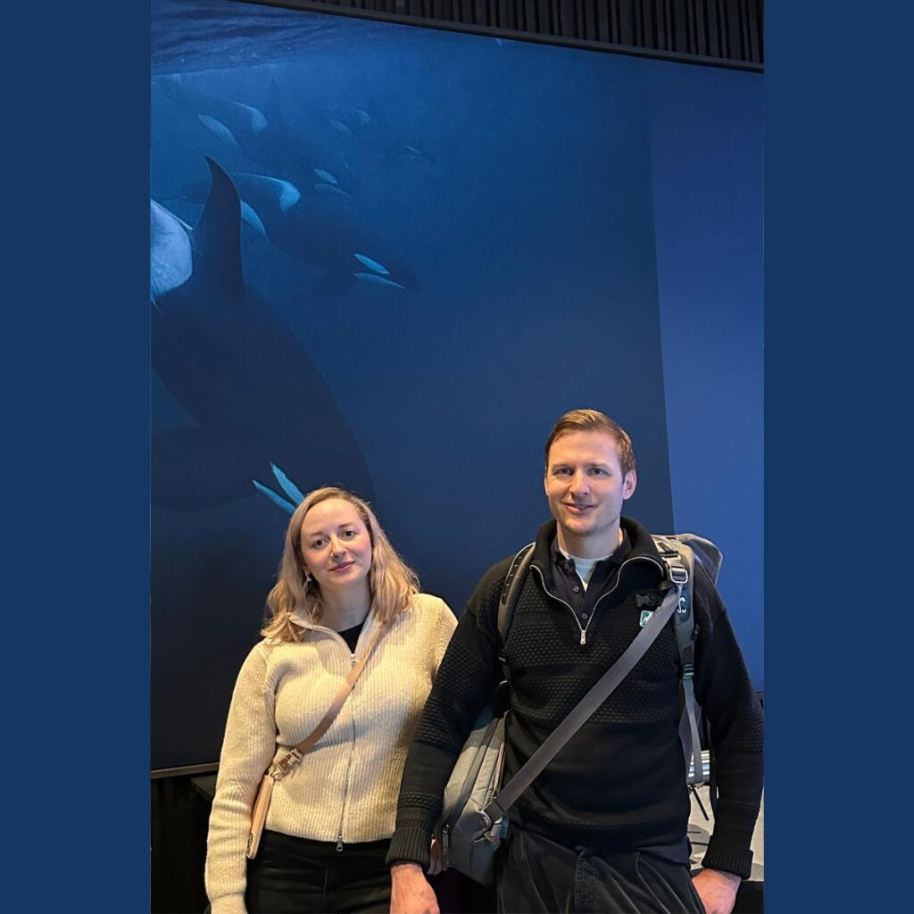 Andreas and Carina in front of the orca display